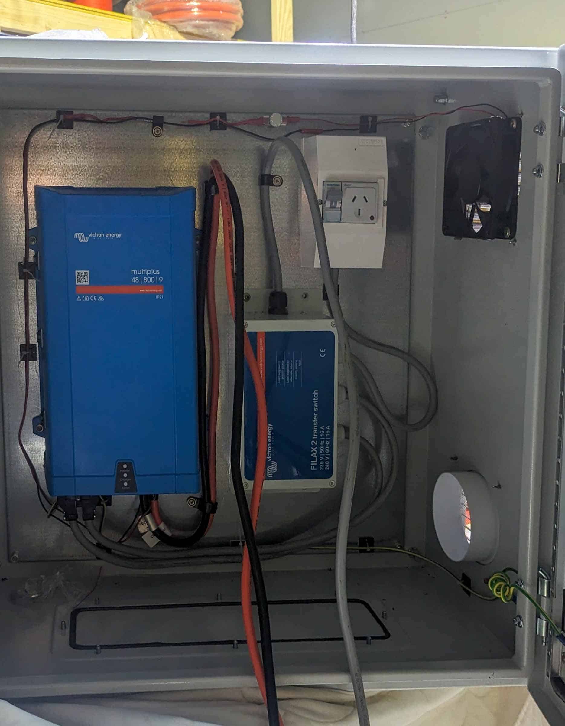 Victron MultiPlus inverter and battery system installed in weatherproof electrical enclosure for off-grid solar application