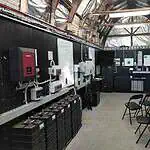 Interior of Smart Energy Lab training facility showing inverters, battery systems and educational displays at Mount Toolebewong