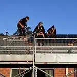 Solar panels being installed on a residential roof in Australia by a professional installer